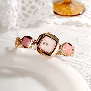 Elegant rose gold women's watch with irregular diamond bracelet and pink mother of pearl dial