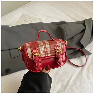 Detailed view of British style red plaid tweed handbag with vintage metal buckles