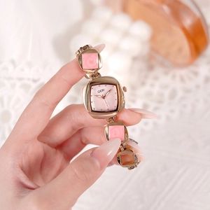 Women's rose gold quartz watch with pink rhombic details and elegant mother-of-pearl dial