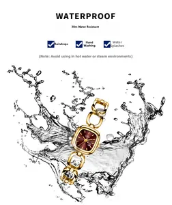 Close-up of gold chain strap watch with red dial showing 30M waterproof feature