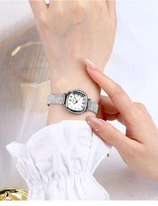 Close-up of GEDI ladies watch with silver glitter metal strap and white rectangular dial