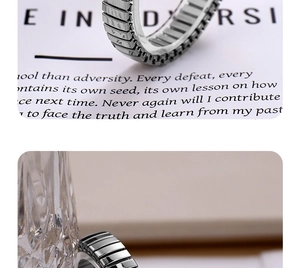 Detailed macro view of industrial style segmented stainless steel ring with metallic luster
