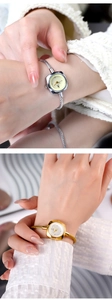 Dettaglio di eleganti orologi a bracciale da donna in metallo intrecciato oro e argento