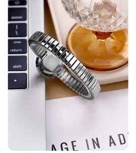 Detail of silver stretchable stainless steel watch band with metallic flexible segments