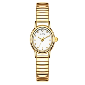 Elegant gold GEDI women's watch with white oval dial and stretchy spring band
