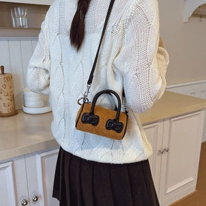 Kids yellow corduroy bucket bag with black bows and leather handle for winter fashion