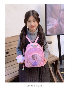 Pink sequin girls backpack with cartoon princess and white cat plush charm detail
