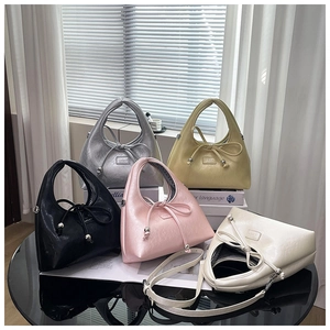 Chic pleated crescent bags in five colors featuring cute bow tie details and textures