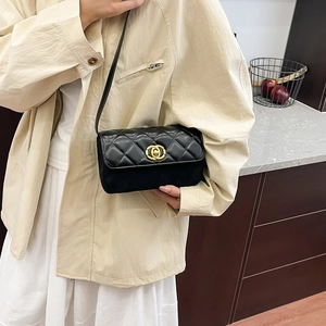 Classic black quilted leather crossbody bag with golden interlocking clasp and shoulder strap