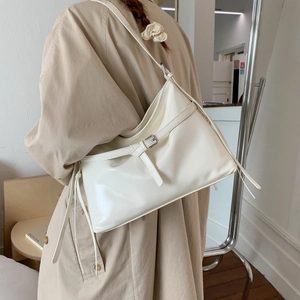 Glossy PU leather large tote bag in ivory white featuring stylish buckle and tassel straps