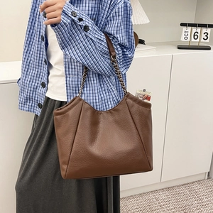 Brown litchi grain faux leather tote bag with silver chain strap and minimalist design