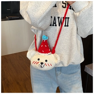 Detail shot of the handcrafted crochet bear shoulder bag with high-quality knit texture