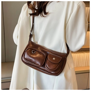 Detail view of retro dark brown leather crossbody bag with functional double pockets