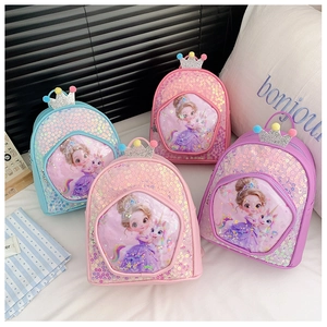 Detail of four colorful sequined kids backpacks with cartoon princess and unicorn motifs