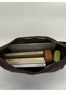 Spacious interior of the large dark brown tote bag showing capacity for a laptop and books
