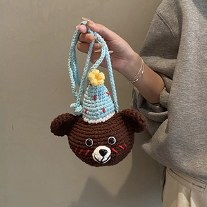 Handmade crochet bear crossbody bag for children with light blue hat and shoulder strap