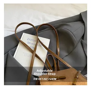 Close-up of adjustable leather shoulder strap on a brown suede bow backpack