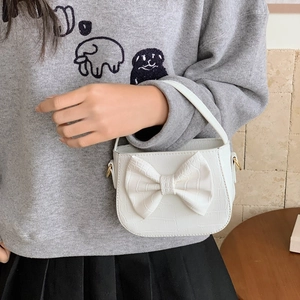 Sweet white crossbody bag for girls with large crocodile pattern bow and top handle