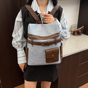 Blue denim and brown leather patchwork travel backpack with vintage buckle flap cover