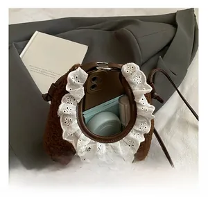 Brown plush crossbody bag with lace edges showing interior storage for daily essentials
