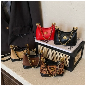 Detailed view of quilted mini chain bags in red black khaki brown and leopard print