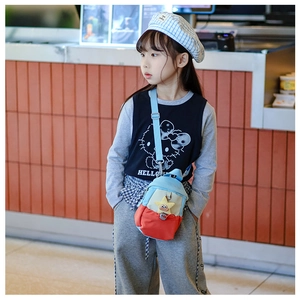 Detail of kids colorful crossbody bag with cute star plush toy and wide shoulder strap