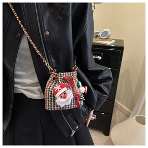 Detail of Christmas plaid mini bucket bag with plush Santa Claus and gold bell
