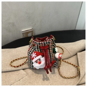 Detailed view of plaid mini bucket bag with festive 3D Santa and snowman charms