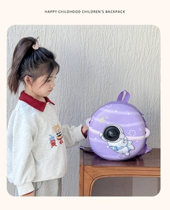 Detail of purple astronaut hardshell backpack shown on a child for school