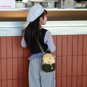Kids colorblock crossbody bag in yellow and green with a cute star charm detail