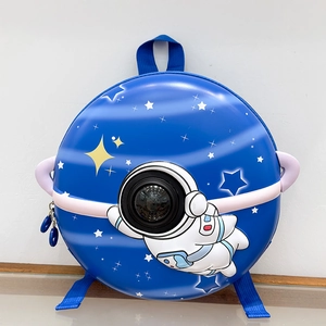 Detail of cartoon astronaut space backpack for kids featuring hard shell and capsule window