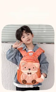 Close-up of orange fox cartoon kids backpack with soft plush details and animal print straps