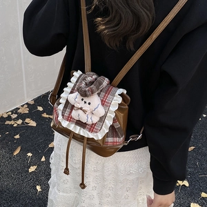 Mochila infantil de cuadros con cachorro de peluche y cuero PU marrón