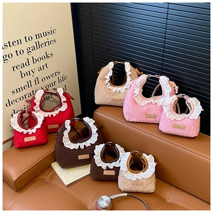 Detailed view of plush lamb wool mini bags with elegant lace trim and Pit Crew labels