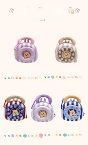 Close-up of lightweight eggshell toddler backpacks in five colors with cute 3D bear designs
