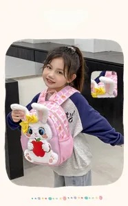 Detailed view of pink toddler backpack with 3D plush rabbit and foldable long ears