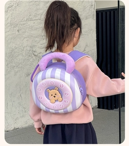 Detail view of purple striped kids backpack with a 3D teddy bear on a rotary dial design