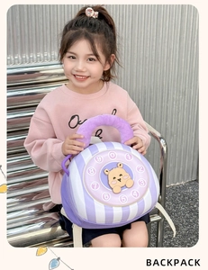 Detail of creative vintage phone design backpack featuring a cute brown cartoon bear