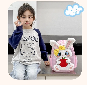 Detail of pink toddler backpack with a 3D plush bunny and mesh side pocket