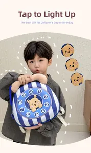 Detail of light-up kids backpack with cute 3D bear and retro dial phone design
