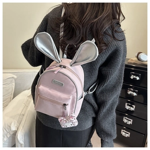 Pink toddler backpack featuring silver bunny ears and Hello Kitty plush charm detail