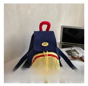 Detail of cartoon star canvas backpack with navy and yellow contrast for kids