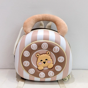 Detail of pink striped shell backpack featuring a vintage phone dial and yellow bear