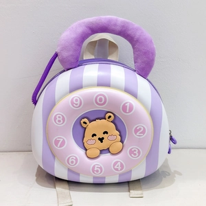 Detail of cute bear toddler backpack with vintage rotary phone dial and purple plush handle