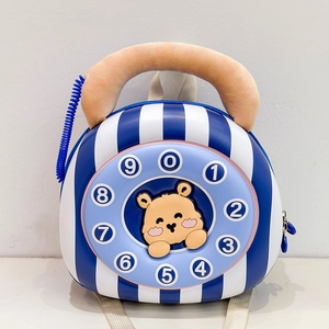 Detail of creative vintage phone design kids backpack with plush handset and dial