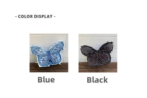 Detail view of denim butterfly bags in blue and black with distressed fringe edges