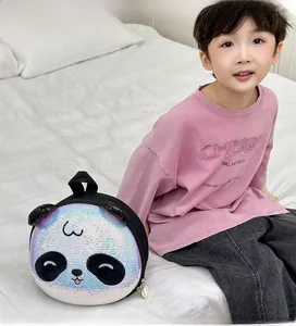 Macro detail of round panda kids bag with shimmering sequins and 3D animal ears