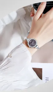 Elegant lady's silver quartz watch featuring a purple dial with crystal-set bezel detail
