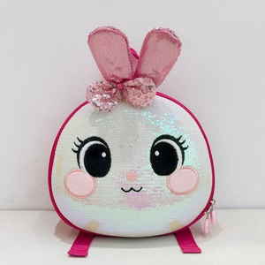 Close-up of sparkling sequin bunny backpack with 3D ears and pink glitter bow detail
