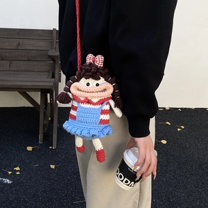 Handmade crochet doll crossbody bag for kids featuring a brown hair girl with red bow